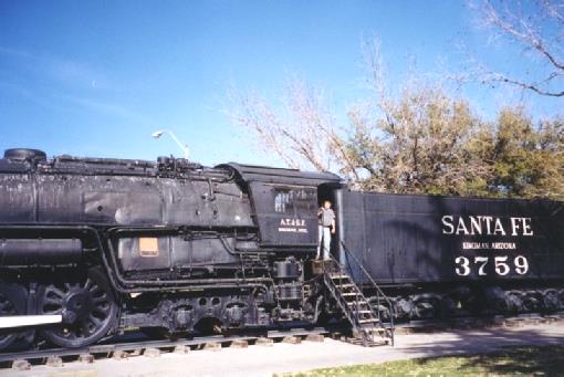 2002-02-21 4 Adrian on an old Santa Fe Steam Engine at Kingman, Arizona