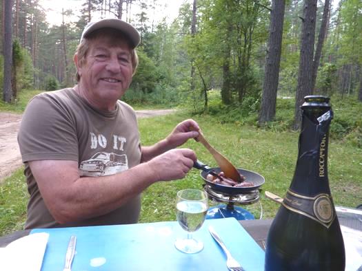 2012-07-26_1922__5742R Adrian cooking supper near Labanoras, Lithuania.JPG