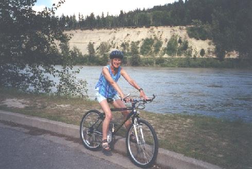 2002-06-15 4 Rosie cycling by the Frazer River at Prince George, British Columbia
